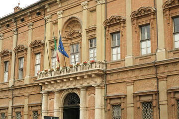 Fototapeta na wymiar Palazzo Ghilini. Palace of the Prefecture of Alessandria.Palazzo Ghilini is a Baroque building built in terracotta bricks, designed by Benedetto Alfieri. 