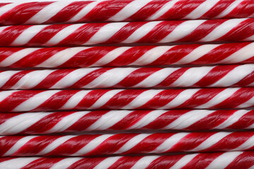 Fototapeta premium Top view of many sweet Christmas candy canes as background, closeup