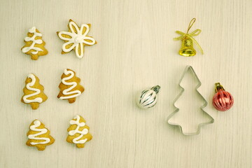 Closeup of fresh baked homemade cookies on a gray background. Christmas background with gingerbread. New Year holiday composition of decorations. Top view, copy space, flat lay.	