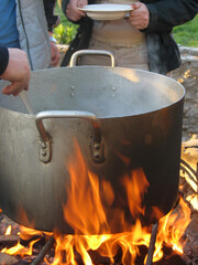 Cooking food in a pot on campfire