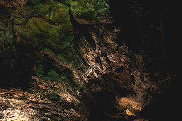 Dark, colorfulTextures of the walls in a lava tube of Canaria island