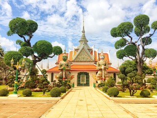 Giants front of the church at Wat Arun. Wat Arun is a Buddhist temple in Bangkok Yai district of Bangkok, Thailand. Wat Arun Temple at sunset in bangkok Thailand.