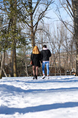 Fototapeta na wymiar young wedding couple walking in the snow