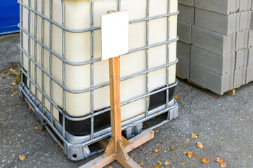 IBC, Eurocube in the construction market on the street, with an empty sign for the price