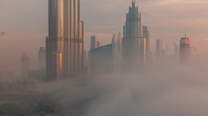 Aerial view of Dubai city early morning during fog timelapse.