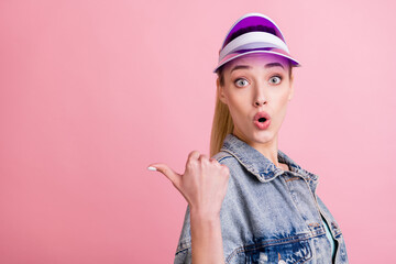 Portrait of attractive amazed girl demonstrating copy blank place space offer pout lips look idea isolated over pink pastel color background