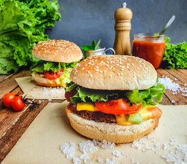 horizontal shot of classic Burger with cheese, salad and sauce 