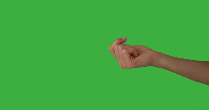 Hand of woman pointing finger and gesturing to come over green background