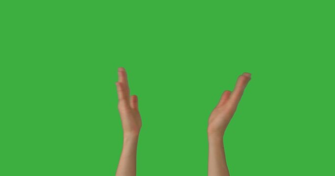 Female hands clapping over green chroma key background