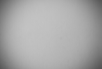 Stucco painted concrete background wall plaster wall. White concrete surfaces for interior design. Gray cement adjusts the edges of the image for the background. White cement plastered concrete wall.
