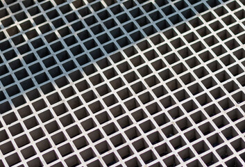 Mesh textured metal panel. Gray steel industrial surface