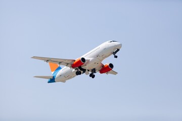 Airplane liner flying above in the beautiful sky. Travel concept.