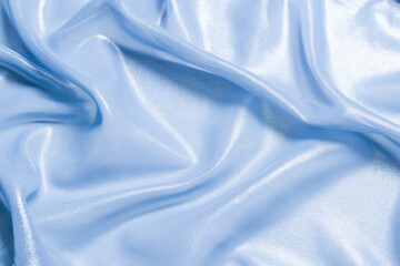 Blue shiny pearl fabric as a background.