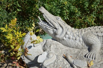 Figure of Crocodile and Fish from Stone in the Park