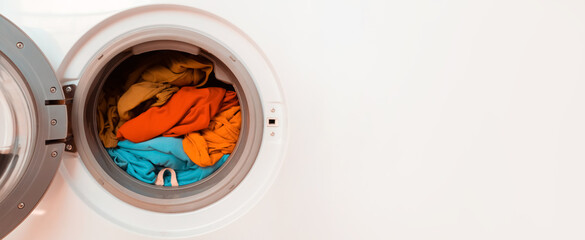 Bright clothes inside washing machine.
