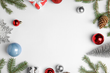 Christmas greeting card with space for text. Flat lay composition of fir tree branches and festive...