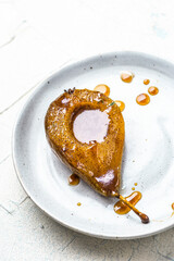 Ripe Pear Poached and Baked in Caramel and Spices. Dessert Serving Portion