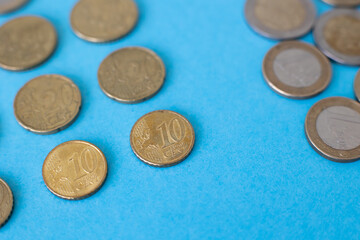 Coins on a blue background isolated Business attraction of euro money