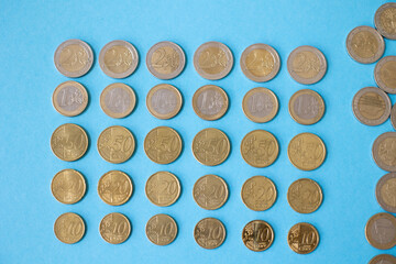 Coins on a blue background Finance flow Cash profit