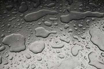 Abstract background with many water drops on a metal surface