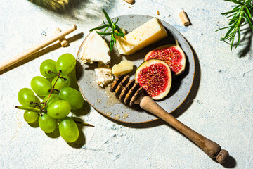 Cheese with Fresh Figs, Grapes, Honey and White Wine