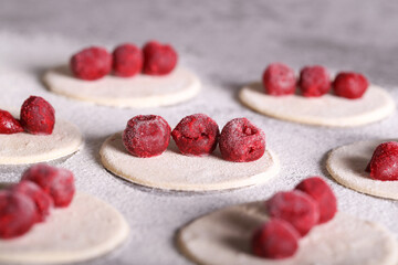 dumplings with cherries are cooked in the kitchen