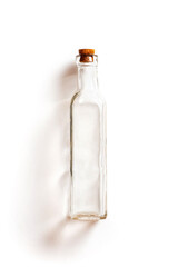 Empty bottle with cork cap on a white background.