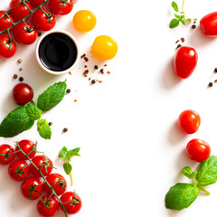 Various spices, tomatoes, olive oil and balsamic vinegar on a white background top view. Free space for text. Food background, ingredients for cooking.