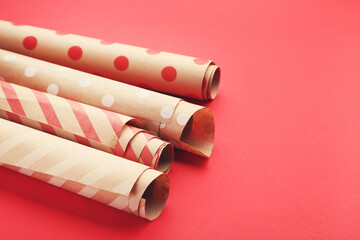 Rolls of craft papers on red background