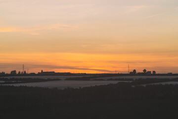 scenic view of a field during sunset