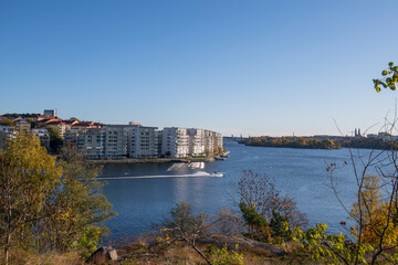 View over the lake Mälaren at the islands Essingeöarna and the skyline of Stockholm a colorful autumn day in Stockholm