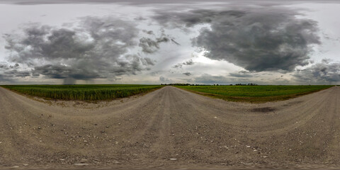360 seamless hdri panorama view on gravel road before storm with overcast sky and dark cloud in...