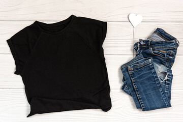 Black t-shirt mockup on whte wooden background. Blank for your design, template mock up.