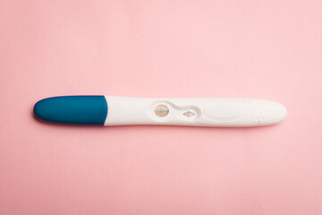 Pregnancy test on a pink background . Positive test. Pregnancy copy space.
