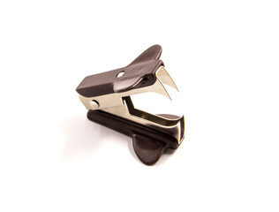 The brown staple remover is used to separate stapled papers.