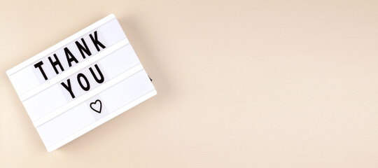 Creative Top view flat lay lightbox with the text thank you. Horizontal long banner for web design with copy space