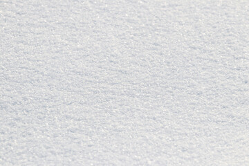 Uniform snow cover. Snow texture on a flat plot of land