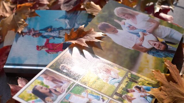 Photobook on the leaves background, closeup of photobook, family photo album