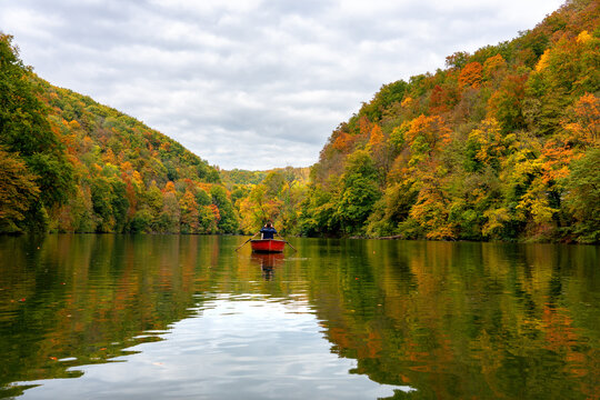 Hamori lake in Lillafured Miskolc pearl of the Bukk Natonal Park in Hungary with red boat while boating