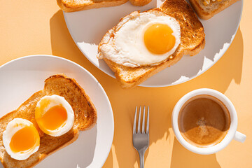 fried Toast bread with four different types of cooked chicken eggs, scrambled eggs, fried eggs, poached egg and creamed egg. Breakfast of chicken eggs. methods of making eggs for breakfast