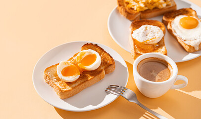 fried Toast bread with four different types of cooked chicken eggs, scrambled eggs, fried eggs, poached egg and creamed egg. Breakfast of chicken eggs. methods of making eggs for breakfast