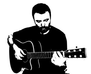 A musician playing fingerstyle acoustic guitar
