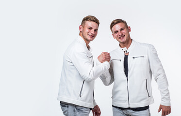 young confident brothers. confident fashion models. copy space. twins brother in white.