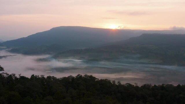4K drone footage of misty landscape view on the famous sunrise viewpoint in Phu Sa nao hill in Muang Chet Ton, Uttaradit province, Thailand.