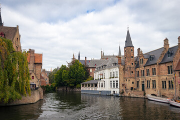 Scenic view of historic buildings, seen from Rozenhoedkaai, one of the most famous tourist attractions in the historic city of Bruges (Dutch: Brugge).