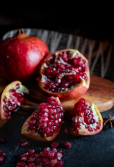 Delicious Pomegranate fruit lies on the  board.