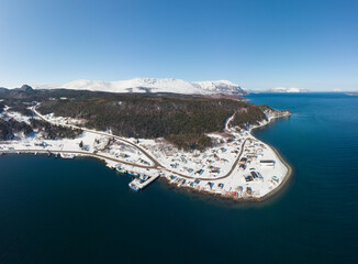 A coating of snow covers a rural coastal town