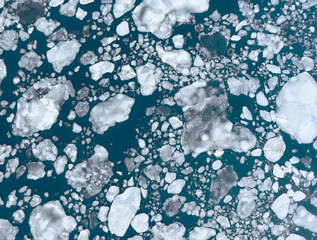 Sea ice on bright blue ocean 