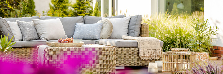 Bright summer day in green garden of elegant suburban home