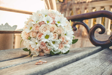 Wedding bridal bouquet of roses and daisies. Delicate garden bouquet of the bride